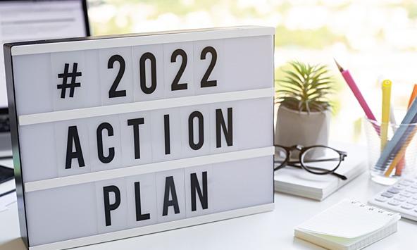 '2022 action plan' sign on desk'2022 action plan' sign on desk